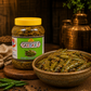 Banarasiya Sardarji green chili paste with a bowl of the product on a wooden surface.