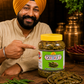  Banaras Sardar Green Chilly Pickle with ingredients around him.